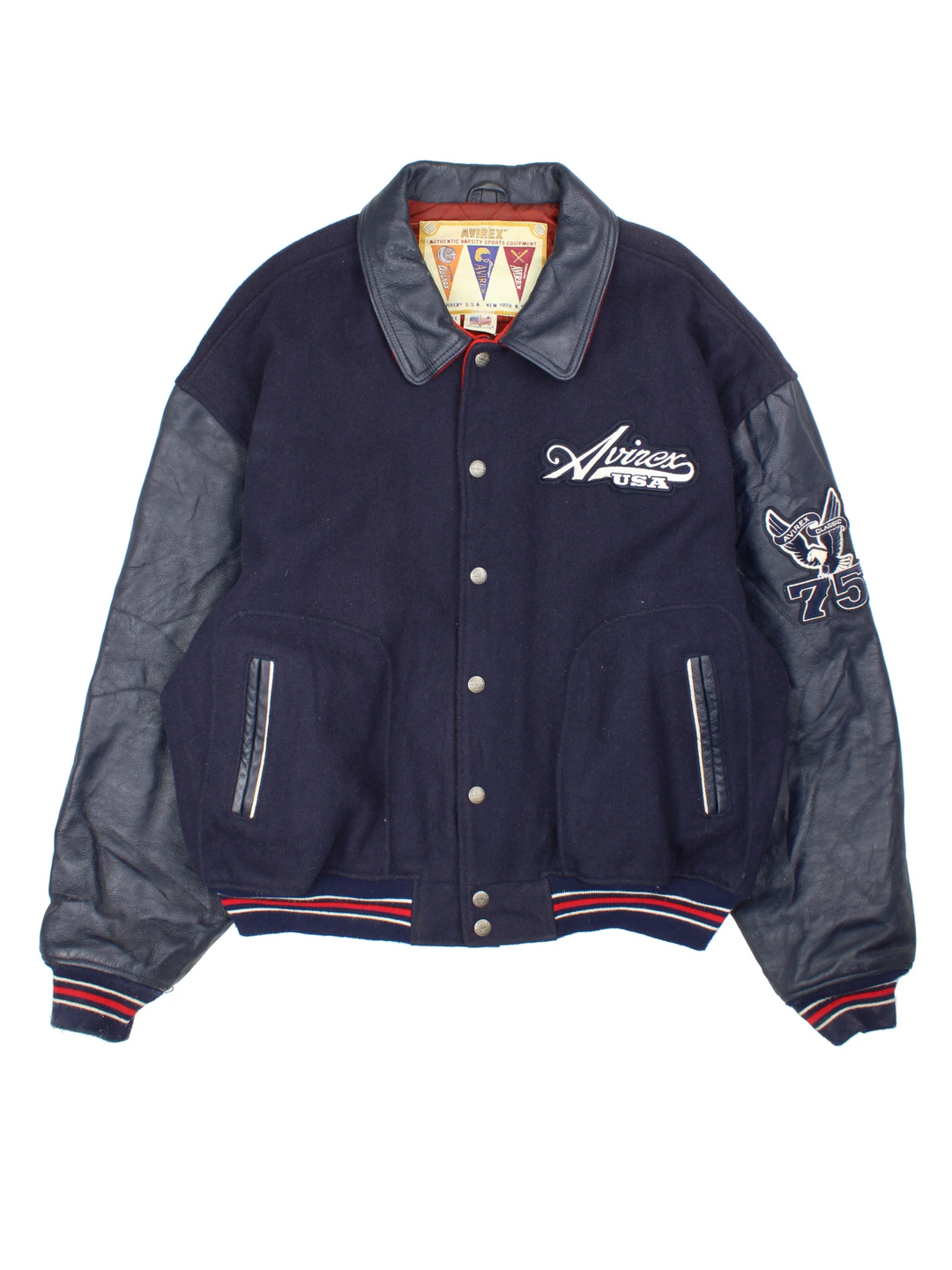 Vintage Avirex USA navy blue Varsity Jacket, embroidered badges on front, sleeve, and back. 