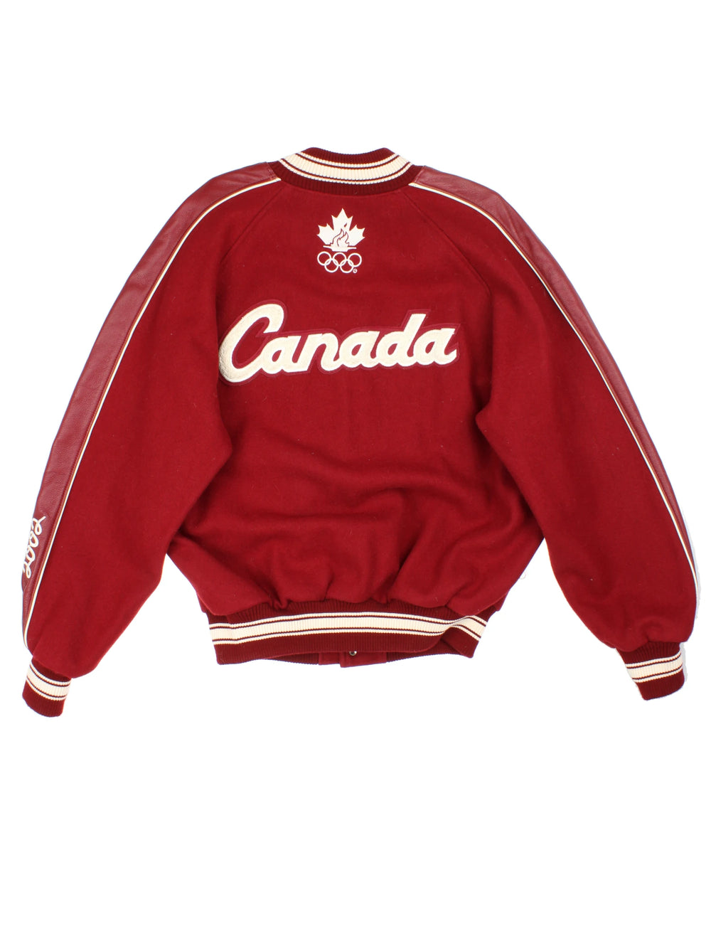 Vintage 2002 Winter Olympics team Canada varsity jacket, by Roots. Features embroidered badges and spell-out details