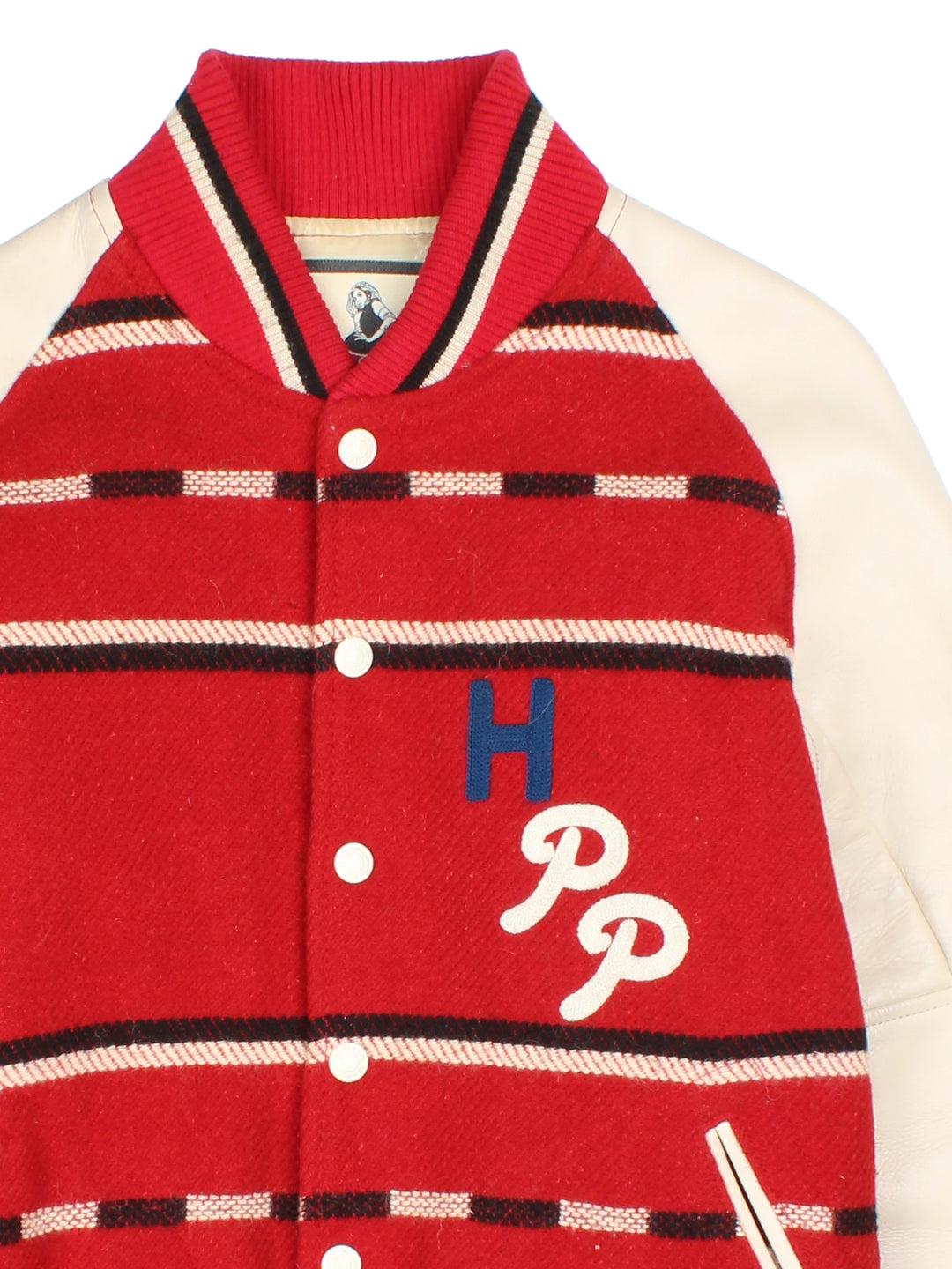 Vintage Hysteric Glamour varsity jacket in a red and cream colourway. The jacket has cream leather sleeves, press studs to close and jetted pockets on the front panels. The jacket is lined with a quilted fabric. and on the back there is a large chain stitched graphic reading 'Hysteric Performance Products'. Hysteric Glamour is a Japanese Streetwear brand, founded in 1984 by artist Nobuhiko Kitamura. 