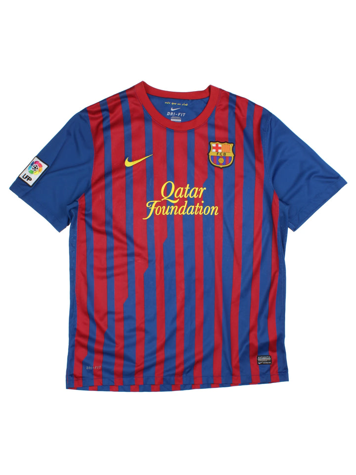 Vintage Barcelona 2011/12, Nike Home Football Shirt, blue, red and yellow colourway, and has logos printed throughout.