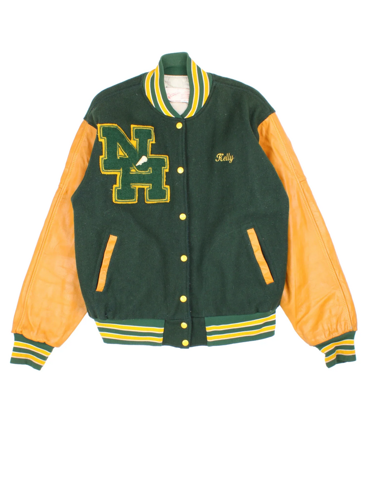 Vintage 2000 N.H.H.S Varsity Jacket in a green/yellow colourway. Features embroidered badges on front and embroidered spell-out on the back. Buttons up and has side pockets, insulated with quilted lining.