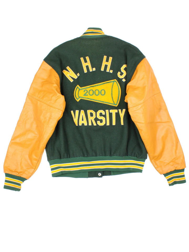 Vintage 2000 N.H.H.S Varsity Jacket in a green/yellow colourway. Features embroidered badges on front and embroidered spell-out on the back. Buttons up and has side pockets, insulated with quilted lining.