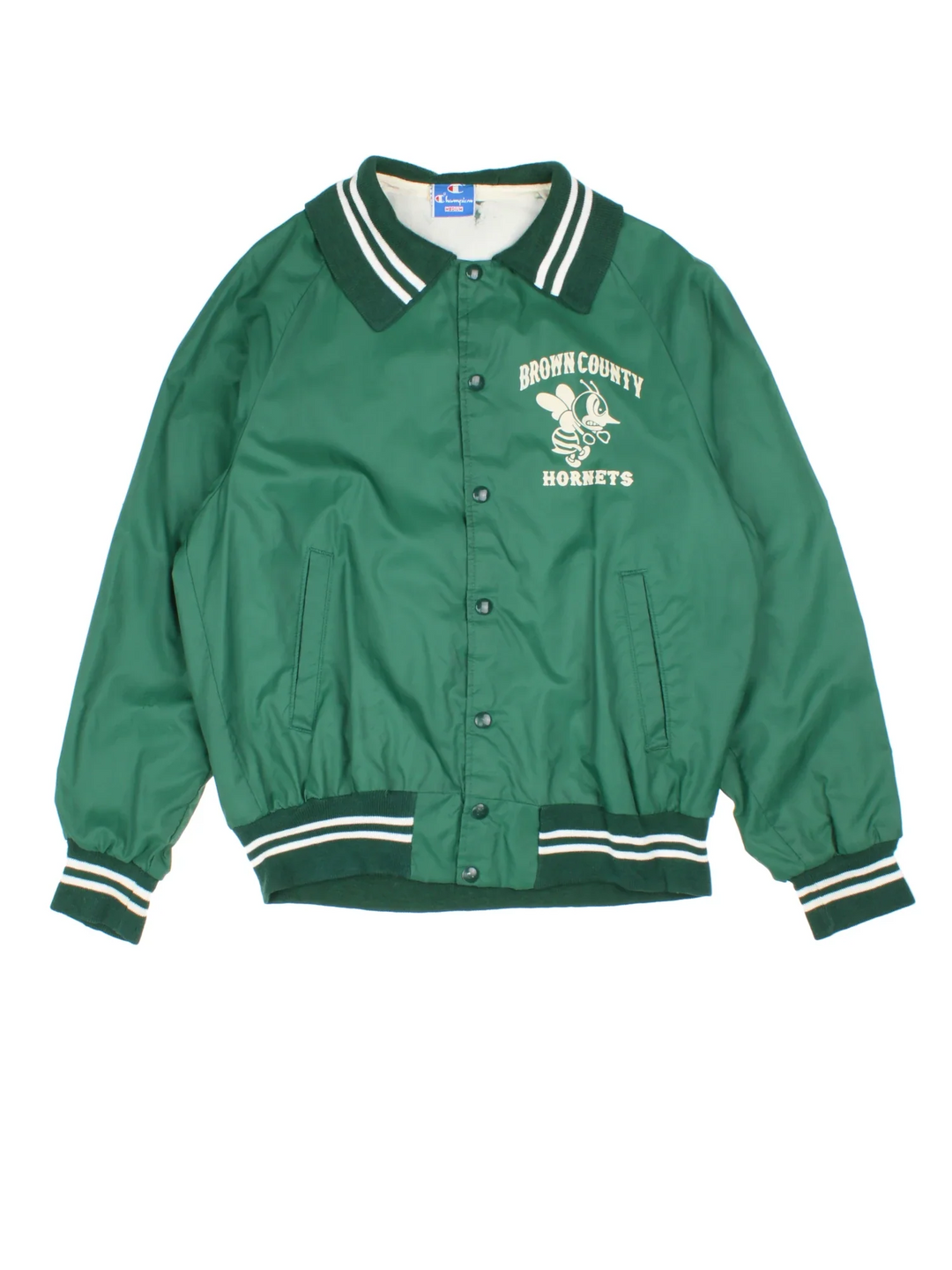 Vintage Champion Brown County Hornets School Baseball Varsity Jacket in a green colourway. Buttons up and has side pockets, big collar, and has the logo printed on the front.