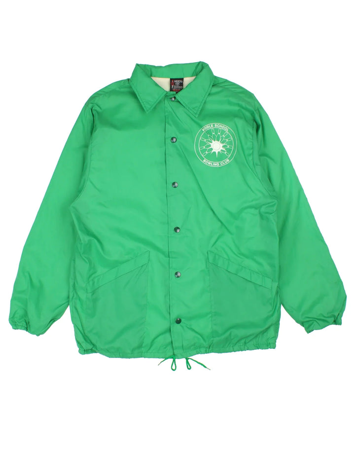 Vintage School Bowling Coach Jacket in a green colourway. Buttons up and has side pockets, and the logo printed on the front.