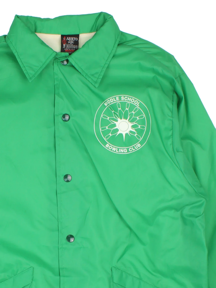 Vintage School Bowling Coach Jacket in a green colourway. Buttons up and has side pockets, and the logo printed on the front.