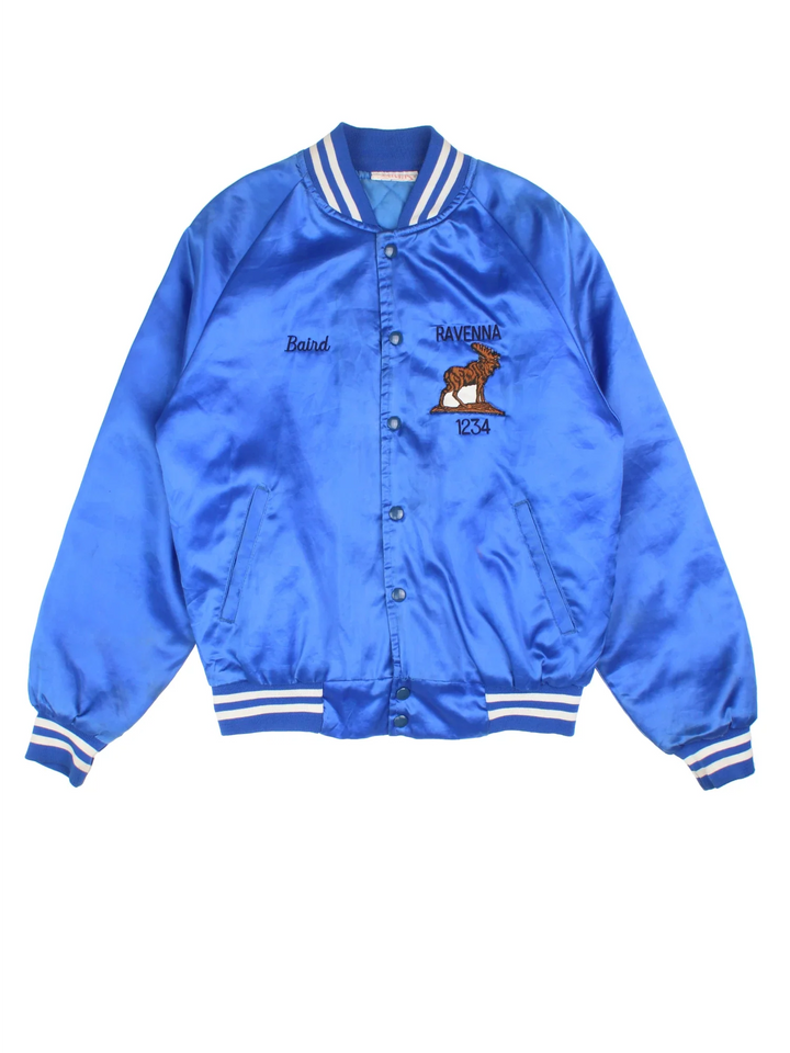 Vintage Ravenna Deer Varsity Jacket in a blue colourway. Buttons up and has side pockets, quilted lining, and has the logos embroidered on the front and big deer garphic on the back.