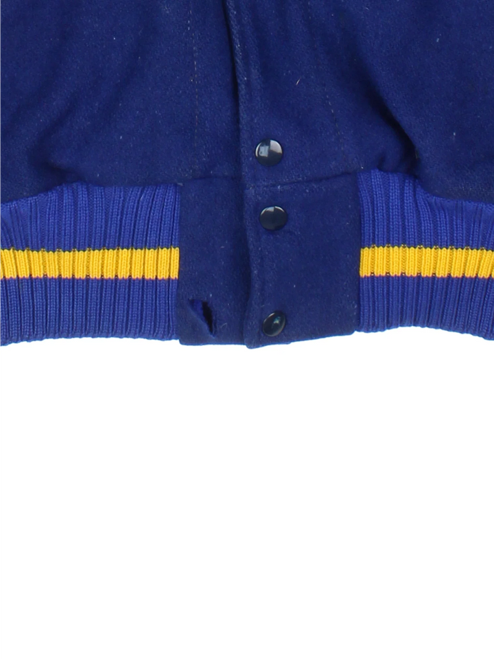 Vintage Varsity Jacket in a blue and tanned colourway. Buttons up and has side pockets.
