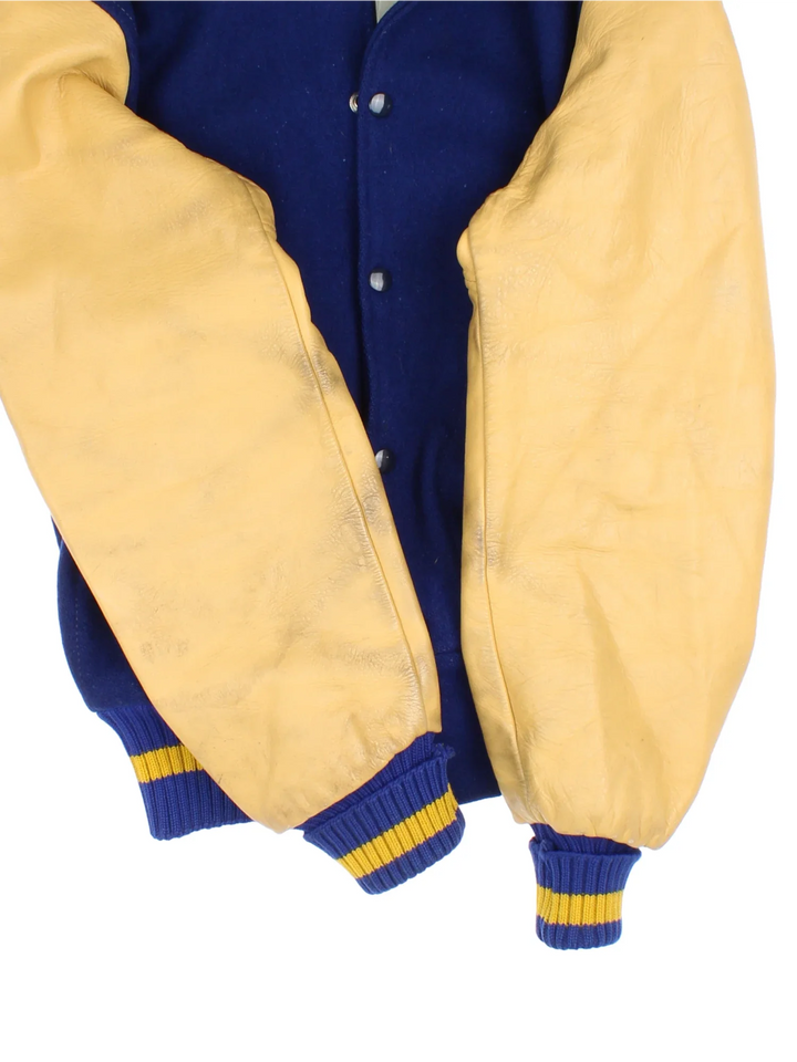 Vintage Varsity Jacket in a blue and tanned colourway. Buttons up and has side pockets.