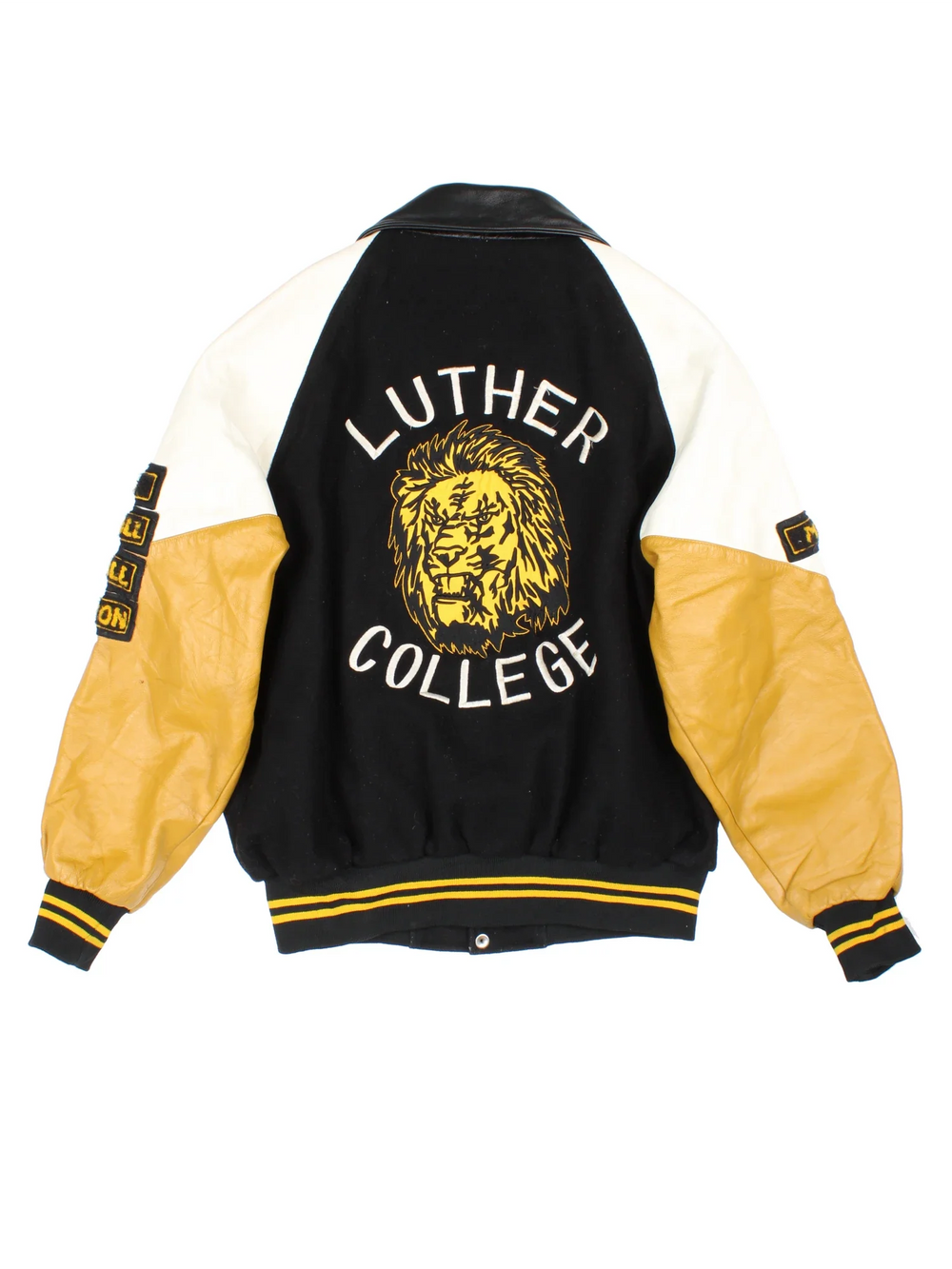 Vintage Luther College Varsity Jacket in a black colourway. Buttons up and has side pockets, quilted lining, and has the logo embroidered on the front and back with large lion graphic.