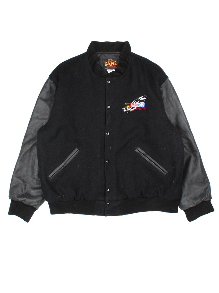 Vintage Nascar Varsity Jacket in a black colourway. Buttons up and has side pockets, quilted lining, and has the logo embroidered on the front and back.