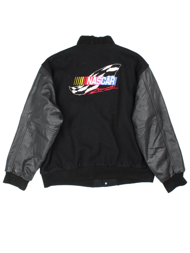 Vintage Nascar Varsity Jacket in a black colourway. Buttons up and has side pockets, quilted lining, and has the logo embroidered on the front and back.