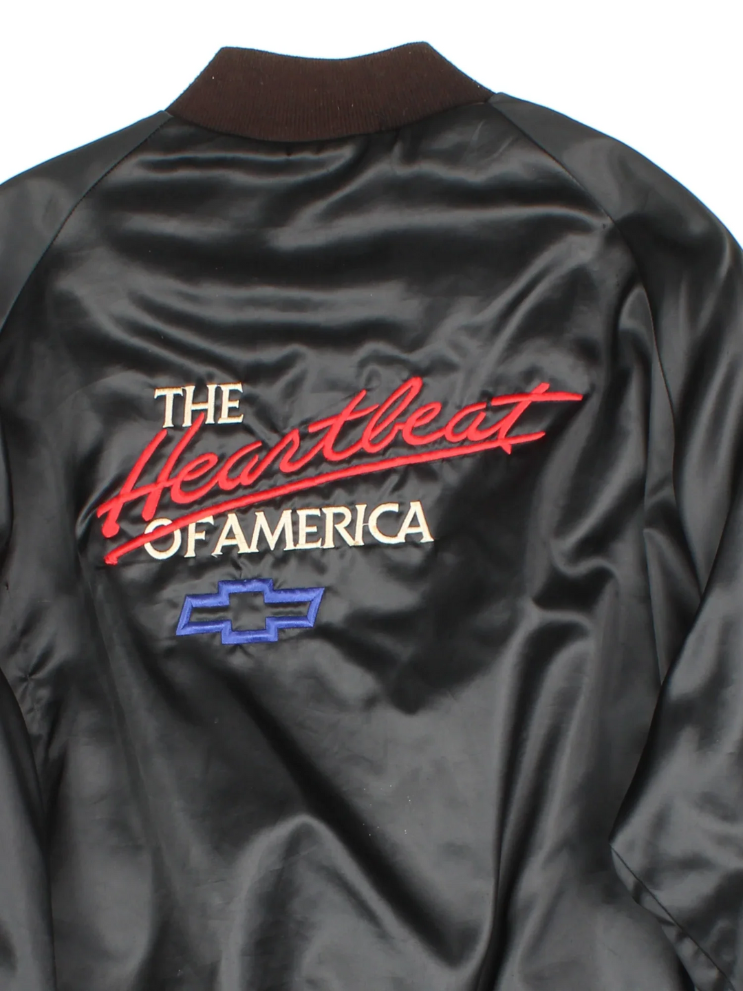Vintage Chevrolet The Heart Of America Varsity Jacket in a black colourway. Buttons up and has side pockets, and the logo / spell out embroidered on the front and back.