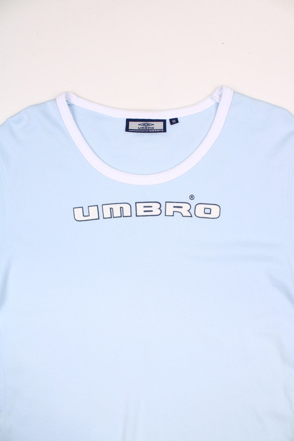 2000's Umbro baby tee in pale blue, features white piping and glittery spell-out detail across the chest