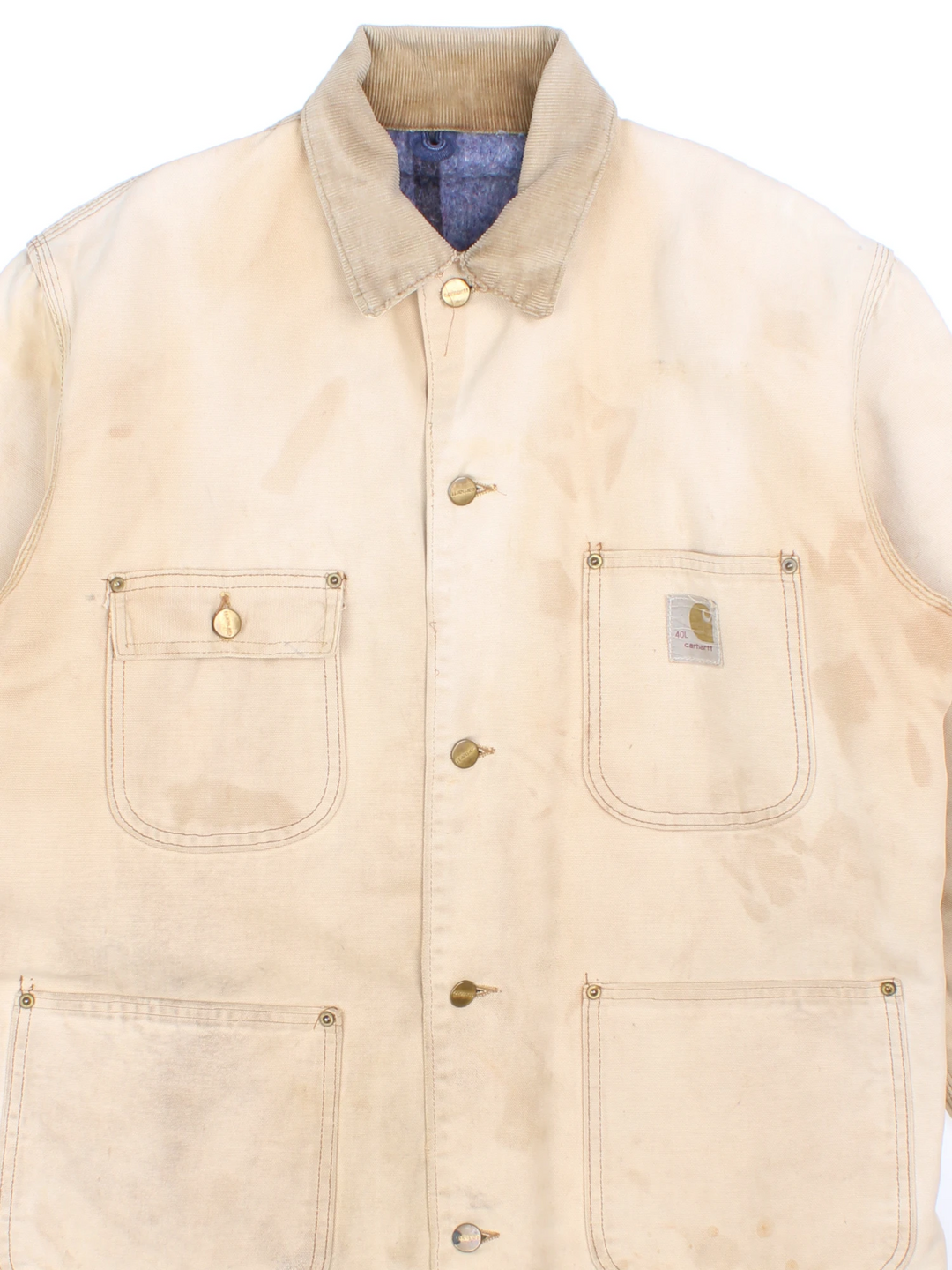 Vintage 70's Carhartt Distressed Chore Jacket in a tan colourway. Buttons up and has multiple pockets, blanket lining, corduroy collar, and has the logo embroidered on the front.