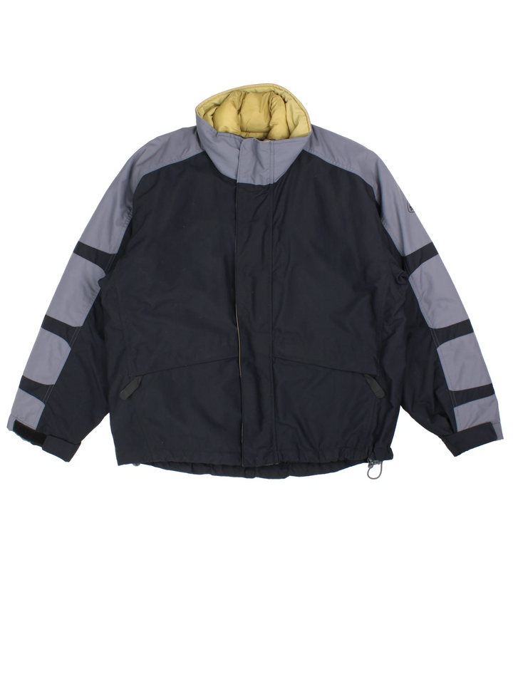 Nike ACG black and grey tech jacket. Features multiple pockets and zip in green quilted liner. 
