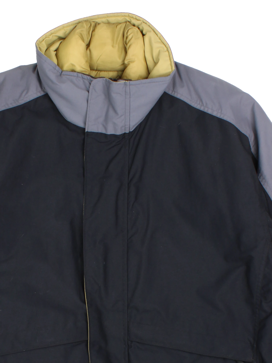 Nike ACG black and grey tech jacket. Features multiple pockets and zip in green quilted liner. 