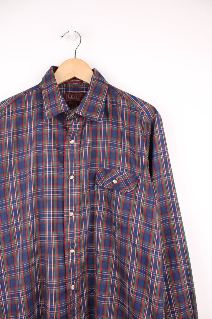 Levi's navy blue, red and green plaid shirt with one flap pocket.  