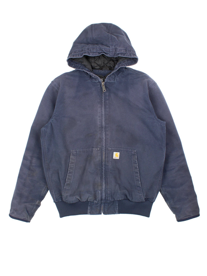 Carhartt Active Jacket in a blue colourway. Zip up closure and has side pockets, insulated with a quilted lining, hooded, and has the logo embroidered on the front.