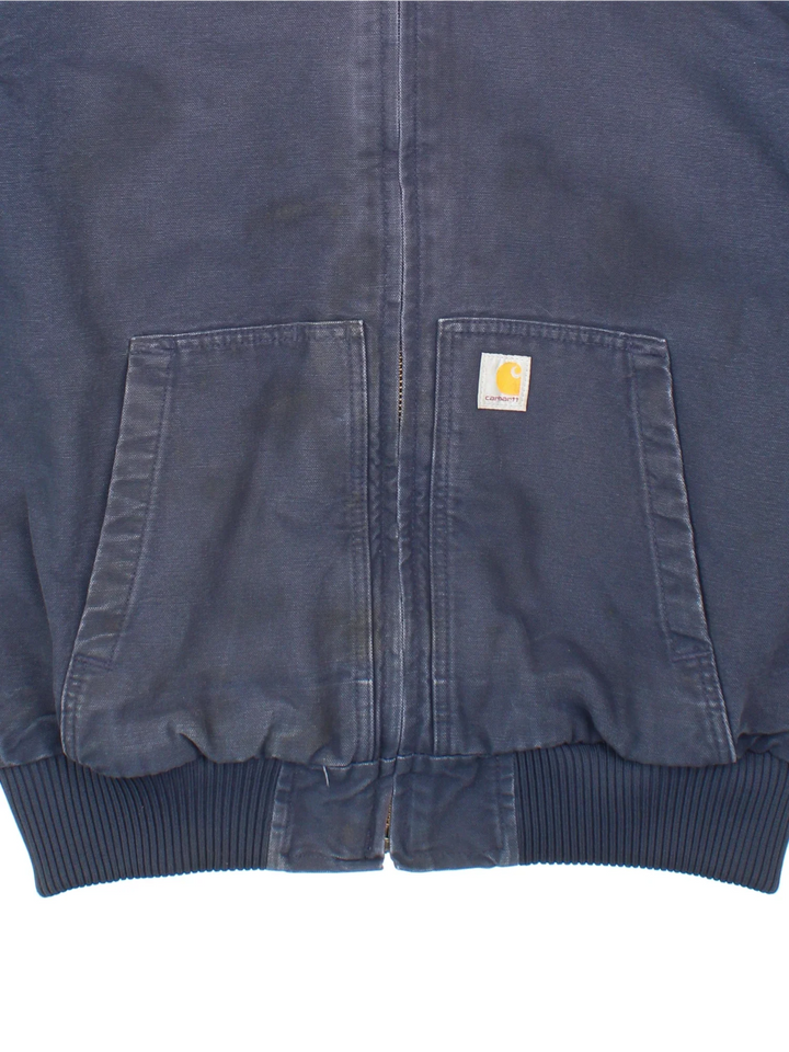 Carhartt Active Jacket in a blue colourway. Zip up closure and has side pockets, insulated with a quilted lining, hooded, and has the logo embroidered on the front.