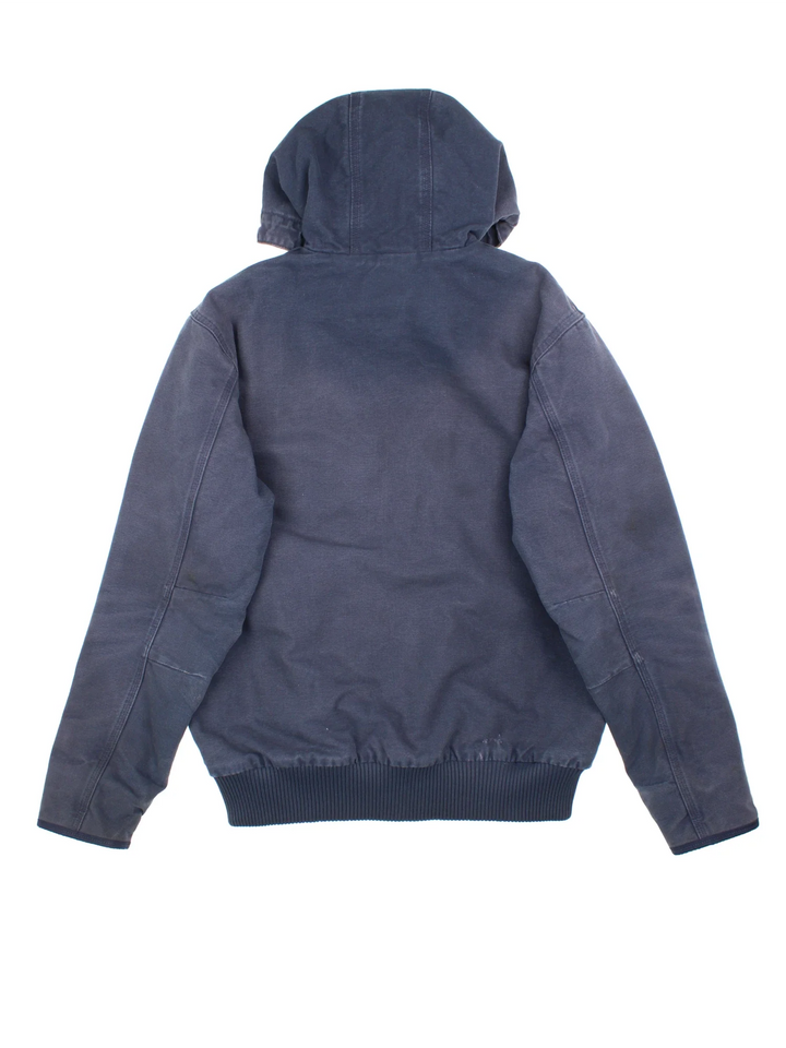 Carhartt Active Jacket in a blue colourway. Zip up closure and has side pockets, insulated with a quilted lining, hooded, and has the logo embroidered on the front.
