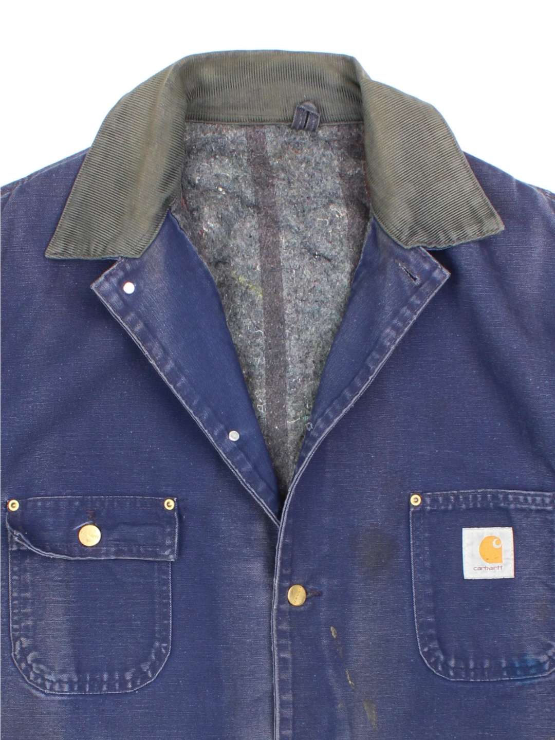 Vintage Carhartt Chore Jacket in a blue colourway with a contrast corduroy collar. Buttons up and has multiple pockets, insulated with a blanket lining, and has the logos embroidered on the front.