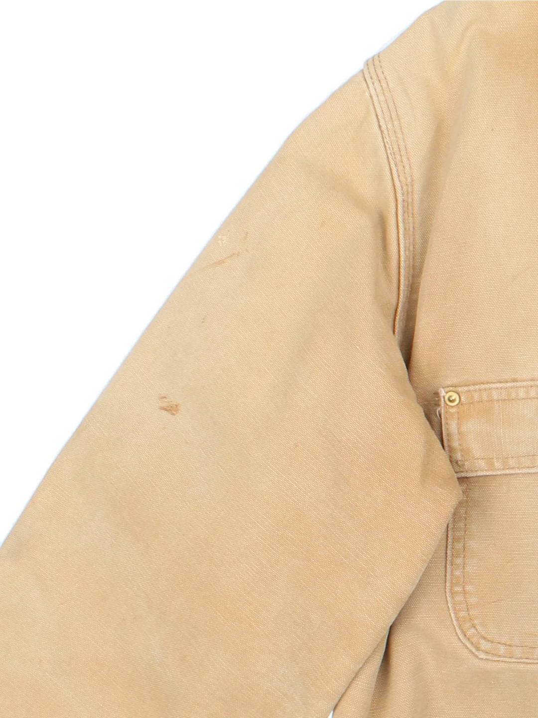 Vintage Carhartt Chore Jacket in a tan colourway. Buttons up and has multiple pockets, insulated with a blanket lining, and has the logos embroidered on the front.