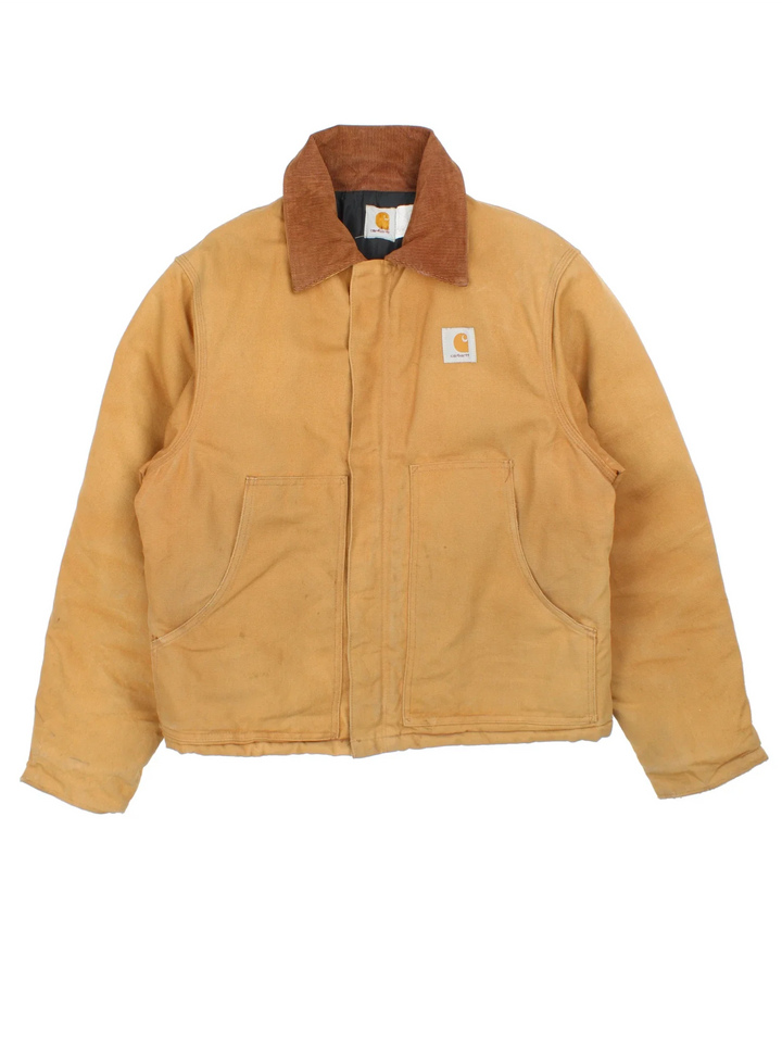 Vintage Carhartt Arctic Jacket in a tan colourway. Zip up closure and has side pockets, insulated with a quilted lining, and has the logos embroidered on the front.