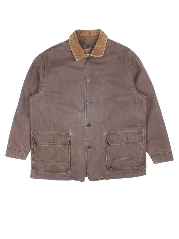 Levi Strauss Chore Jacket in a brown colourway with a corduroy collar. Button up closure and has double front pockets, insulated with a detachable tartan fleece lining.