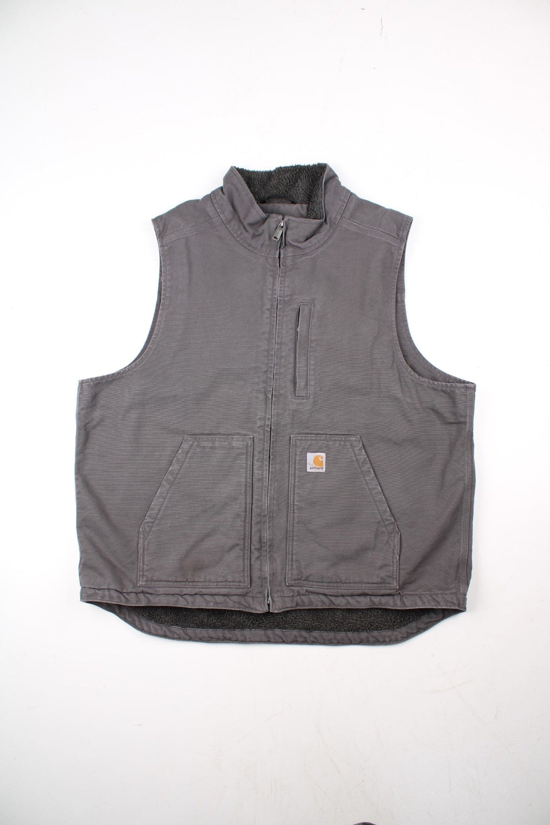 Vintage Carhartt Gilet in a grey colourway. Zip up with double pockets on front, insulated with a fleece lining and classic logo on the front.