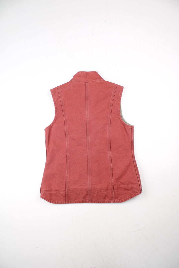 Vintage Carhartt Gilet in a pink colourway. Zip up with double pockets on front, insulated with a sherpa lining and classic logo on front.