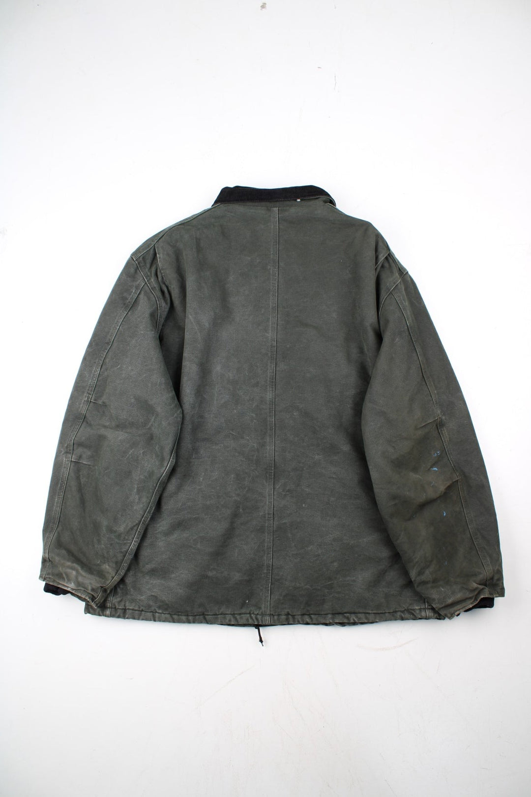 Carhartt Arctic Jacket in a green colourway with a black corduroy collar. Zips up and has multiple pockets, insulated with a quilted lining, and has the logo embroidered on the front.