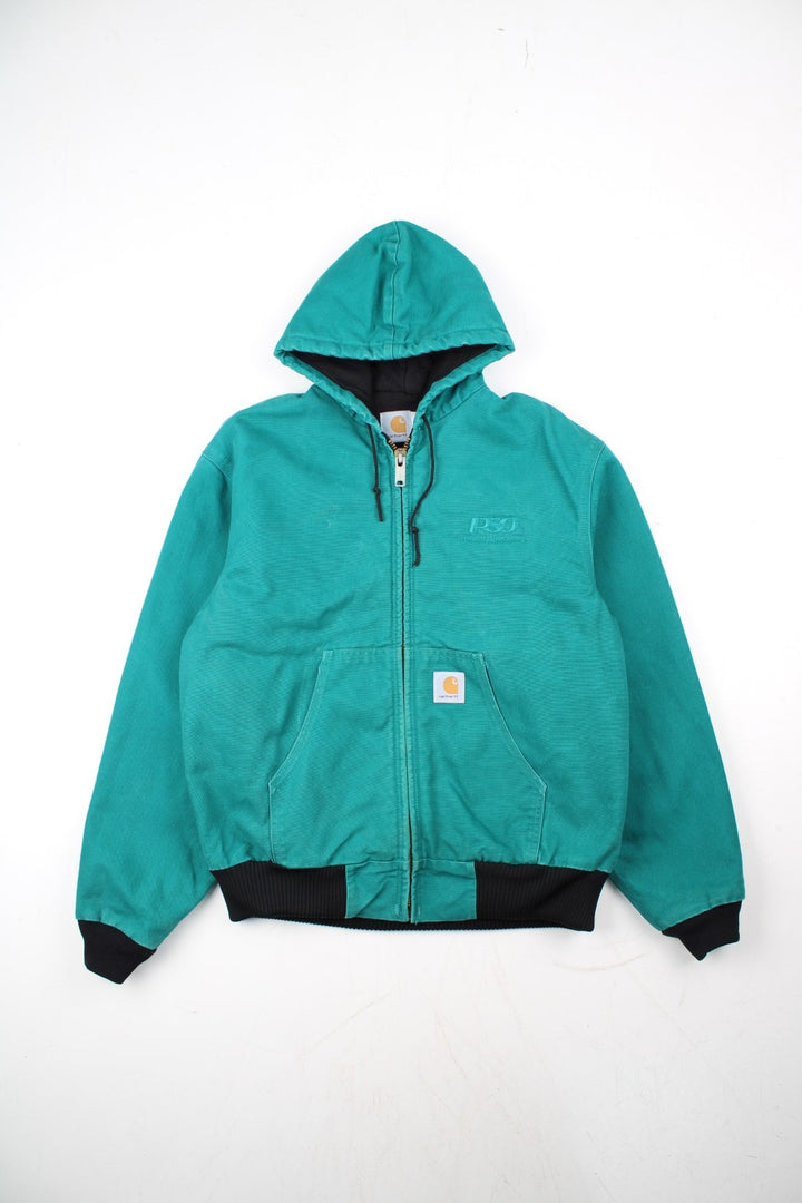Carhartt Active Jacket in a blue colourway. Zips up and has side pockets, hooded, and has the logo embroidered on the front alongside 'PSO' company logo.