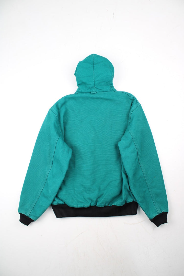 Carhartt Active Jacket in a blue colourway. Zips up and has side pockets, hooded, and has the logo embroidered on the front alongside 'PSO' company logo.