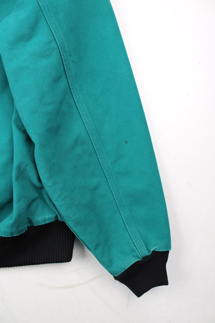 Carhartt Active Jacket in a blue colourway. Zips up and has side pockets, hooded, and has the logo embroidered on the front alongside 'PSO' company logo.