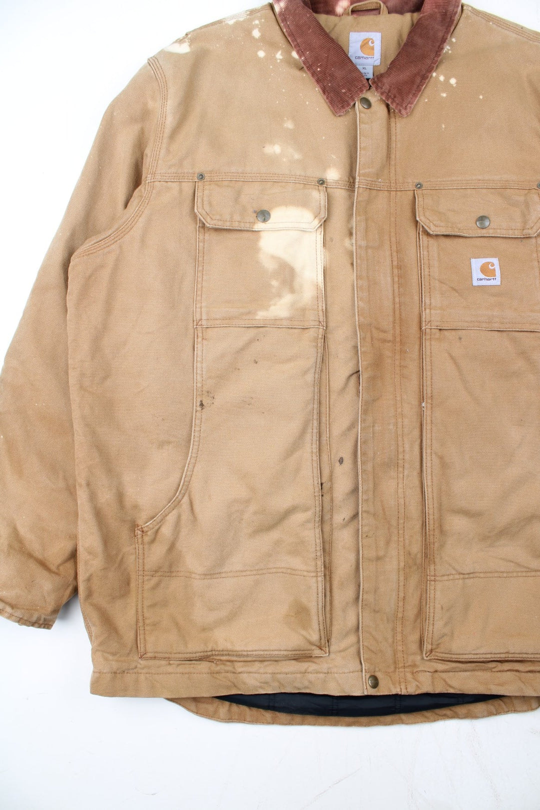 Vintage Carhartt Arctic Jacket in a tan brown colourway. Zips up and has multiple pockets, insulated with a quilted lining, and has the logo embroidered on the front.