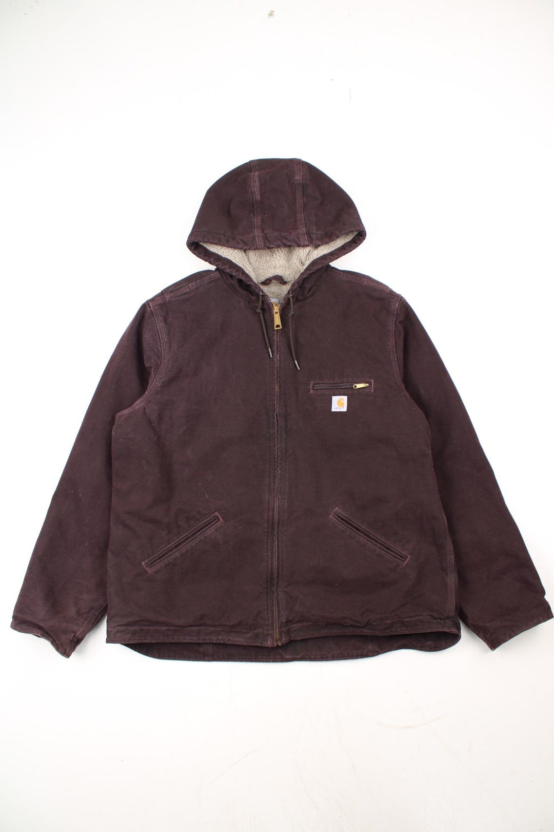 Carhartt Sierra Jacket in a purple colourway. Zips up and has multiple pockets, insulated with a sherpa lining, and has the logo embroidered on the front.