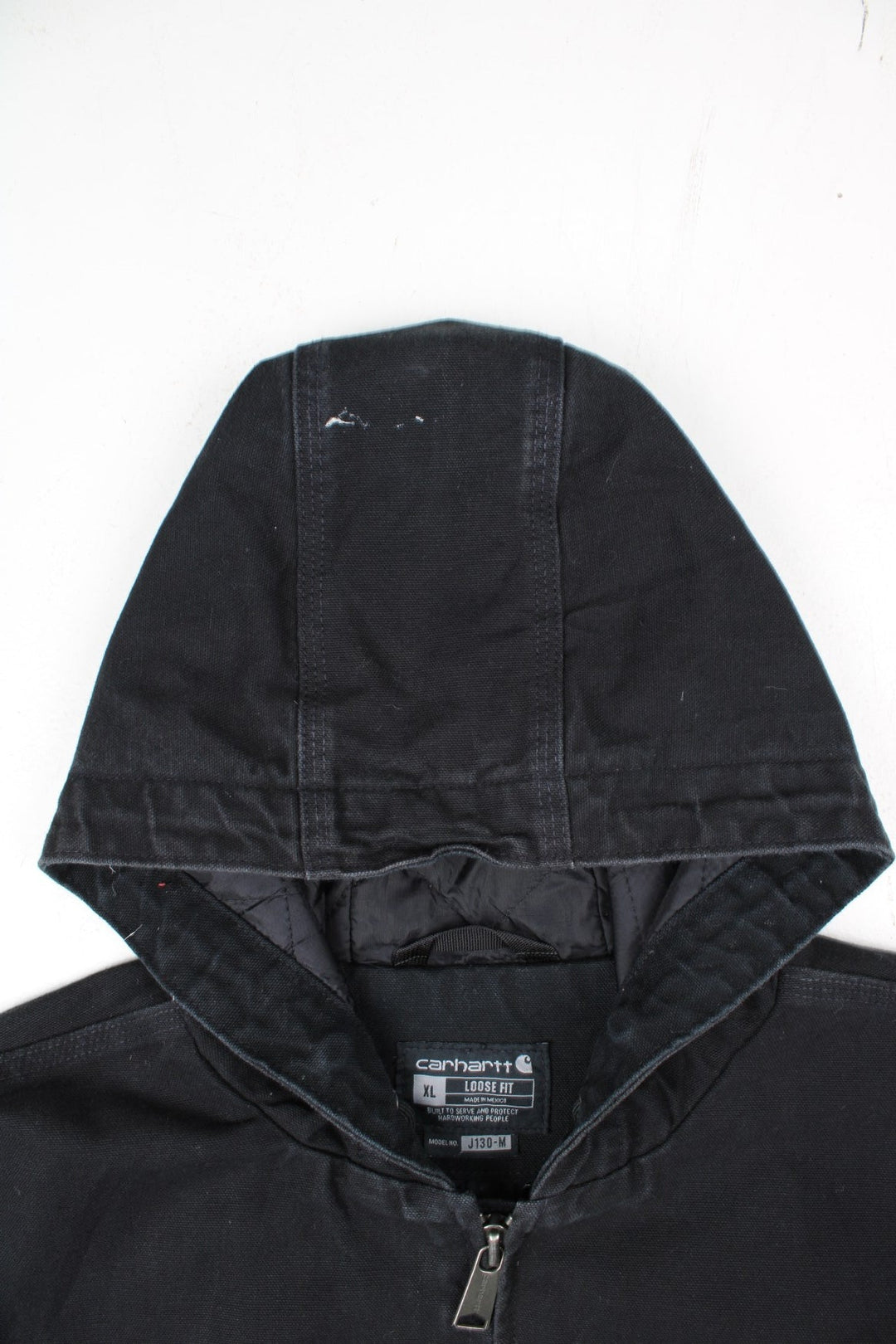 Carhartt Active Jacket in a black colourway. Zips up and has side pockets, insulated with a quilted lining, and has the logo embroidered on the front.