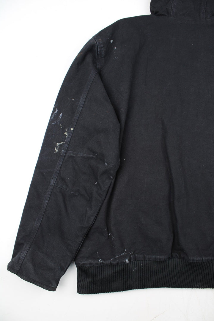 Carhartt Active Jacket in a black colourway. Zips up and has side pockets, insulated with a quilted lining, and has the logo embroidered on the front.