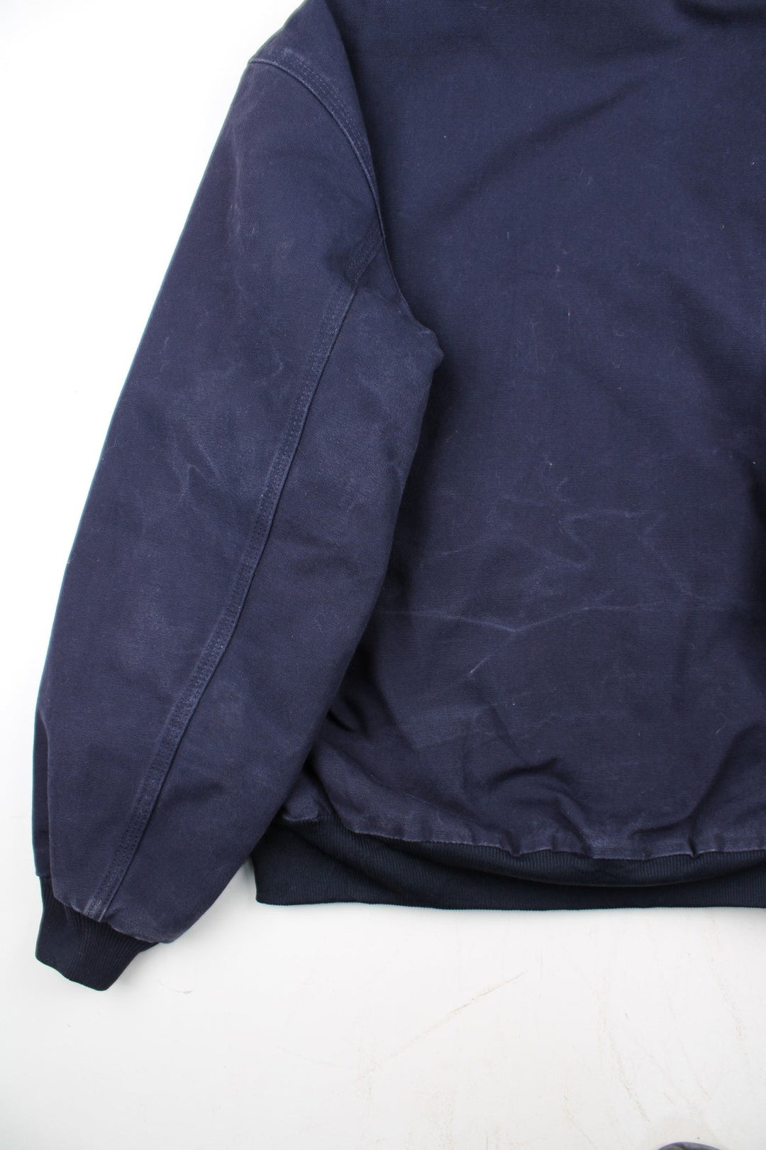 Vintage Carhartt FFA Agricultural Education Active Jacket in a blue colourway. Zips up and has side pockets, insulated with a quilted lining, and has the logo embroidered on the front alongside the FFA logo.