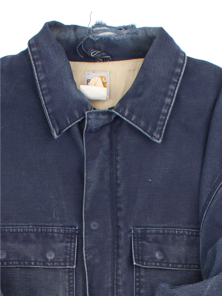 Vintage Carhartt Arctic Jacket in a blue colourway. Zips up and has multiple pockets, insulated with a quilted lining, and has the logo embroidered on the front.