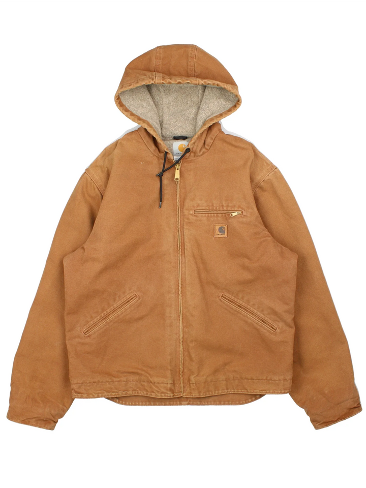 Vintage Carhartt Sierra Jacket in a tan colourway. Zips up and has multiple pockets, insulated with a sherpa lining, and has the logo embroidered on the front.