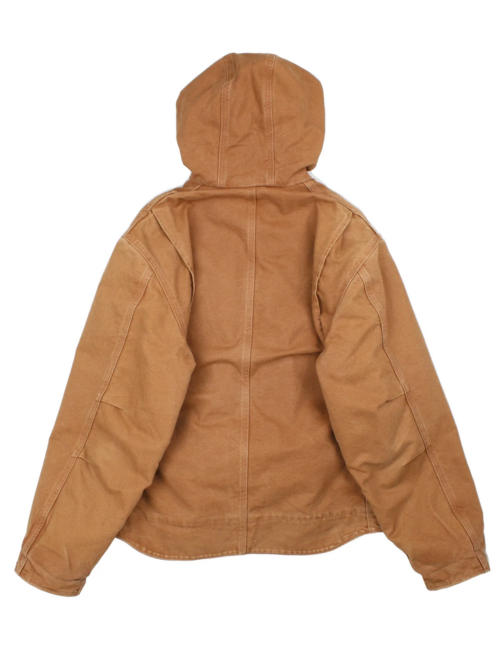 Vintage Carhartt Sierra Jacket in a tan colourway. Zips up and has multiple pockets, insulated with a sherpa lining, and has the logo embroidered on the front.