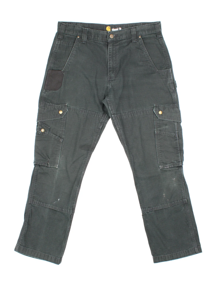 Carhartt Cargo Trousers in a black colourway with multiple pockets and the logo embroidered on the back.