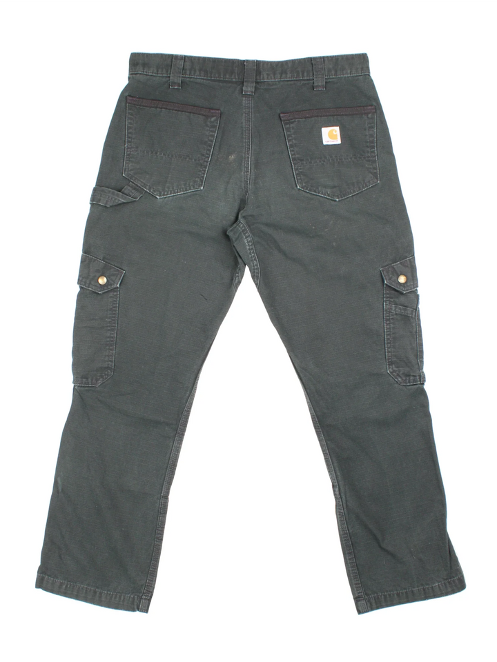 Carhartt Cargo Trousers in a black colourway with multiple pockets and the logo embroidered on the back.