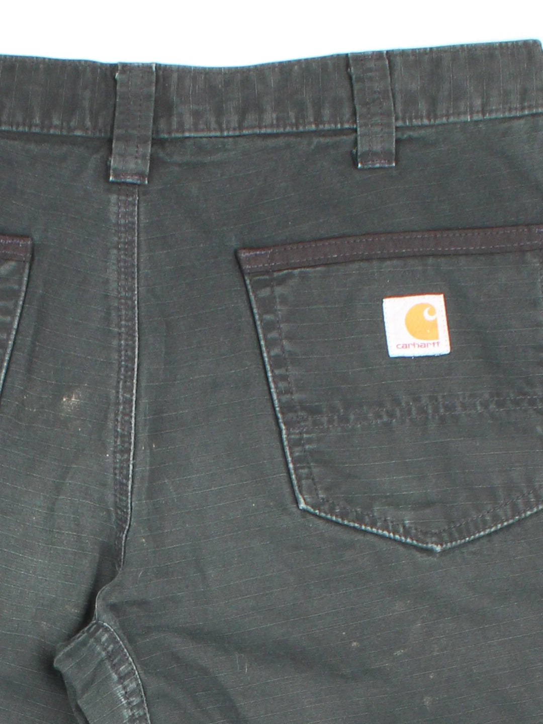 Carhartt Cargo Trousers in a black colourway with multiple pockets and the logo embroidered on the back.
