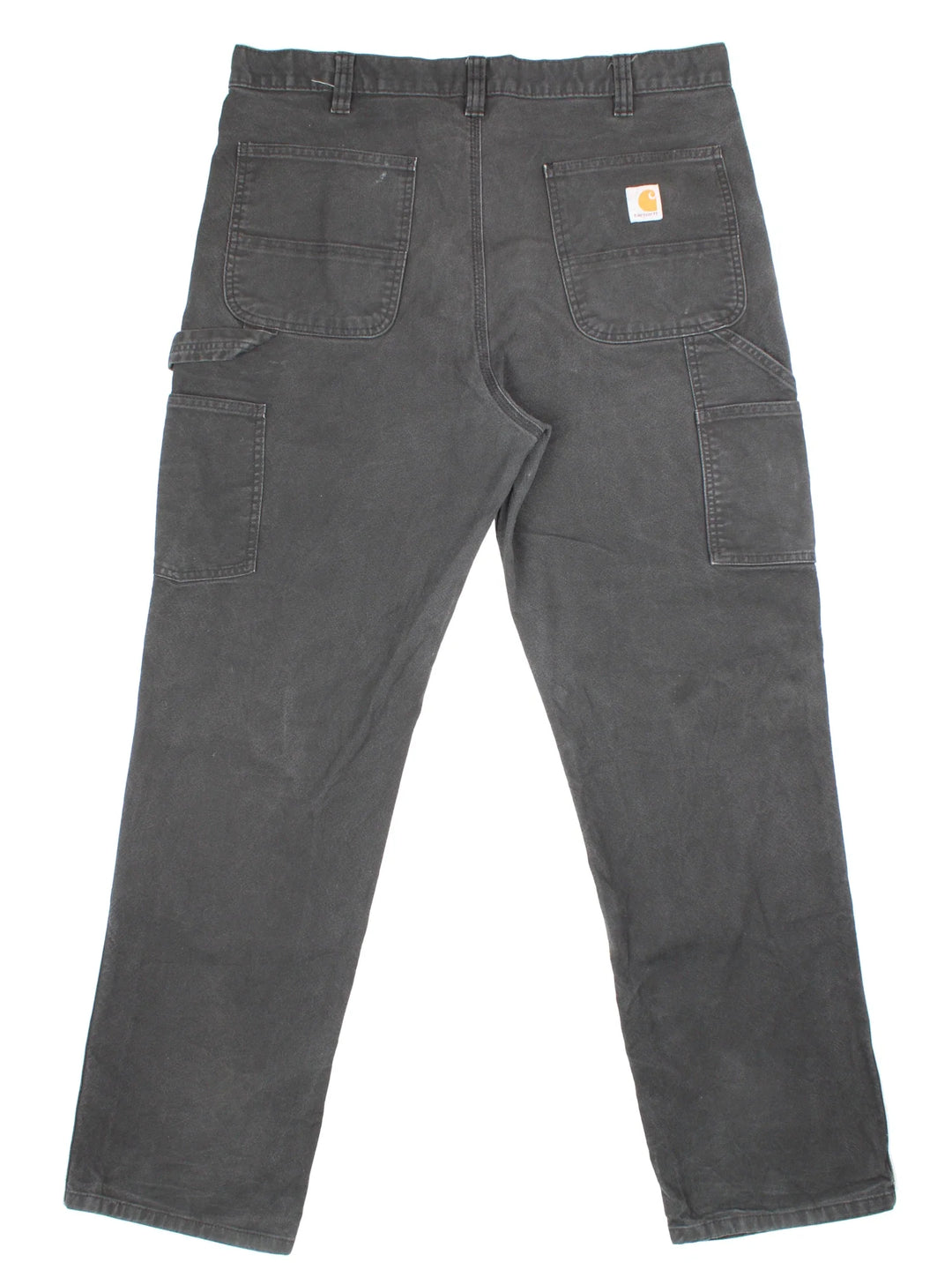 Carhartt Double Knee Jeans in a black colourway with multiple pockets and the logo embroidered on the back.