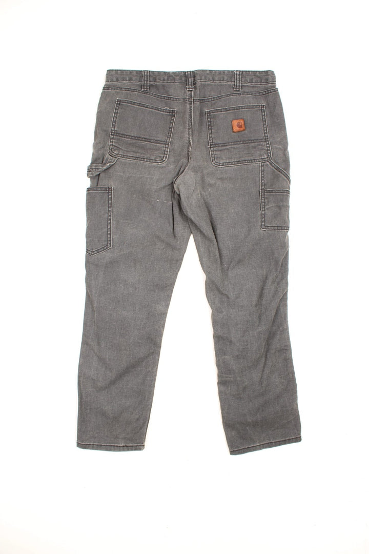 Carhartt Double Knee Jeans in a faded grey colourway, slim straight leg, multiple pockets and has the logo embroidered on the back. 