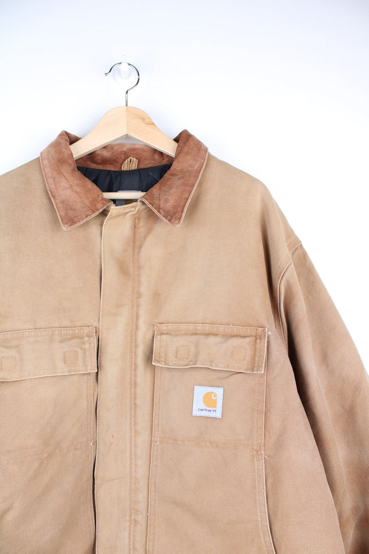 Vintage  Arctic Jacket in a  colourway. The jacket has 2 velcro pockets, and two hand warmer pockets. It also has a corduroy collar and has a quilted lining.