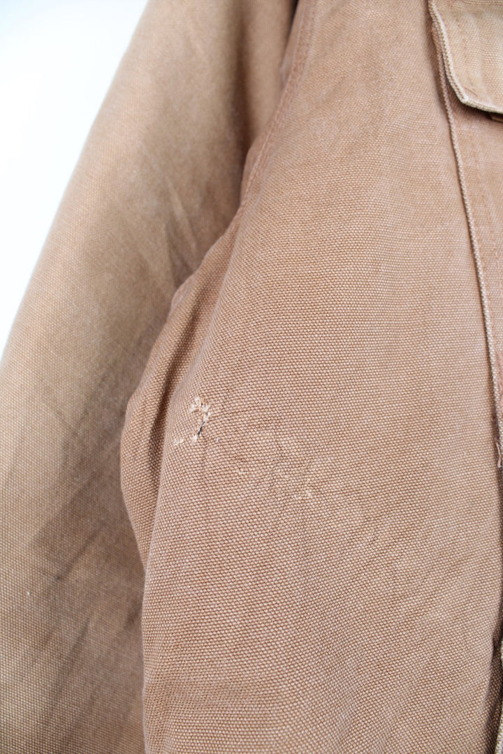 Vintage  Arctic Jacket in a  colourway. The jacket has 2 velcro pockets, and two hand warmer pockets. It also has a corduroy collar and has a quilted lining.