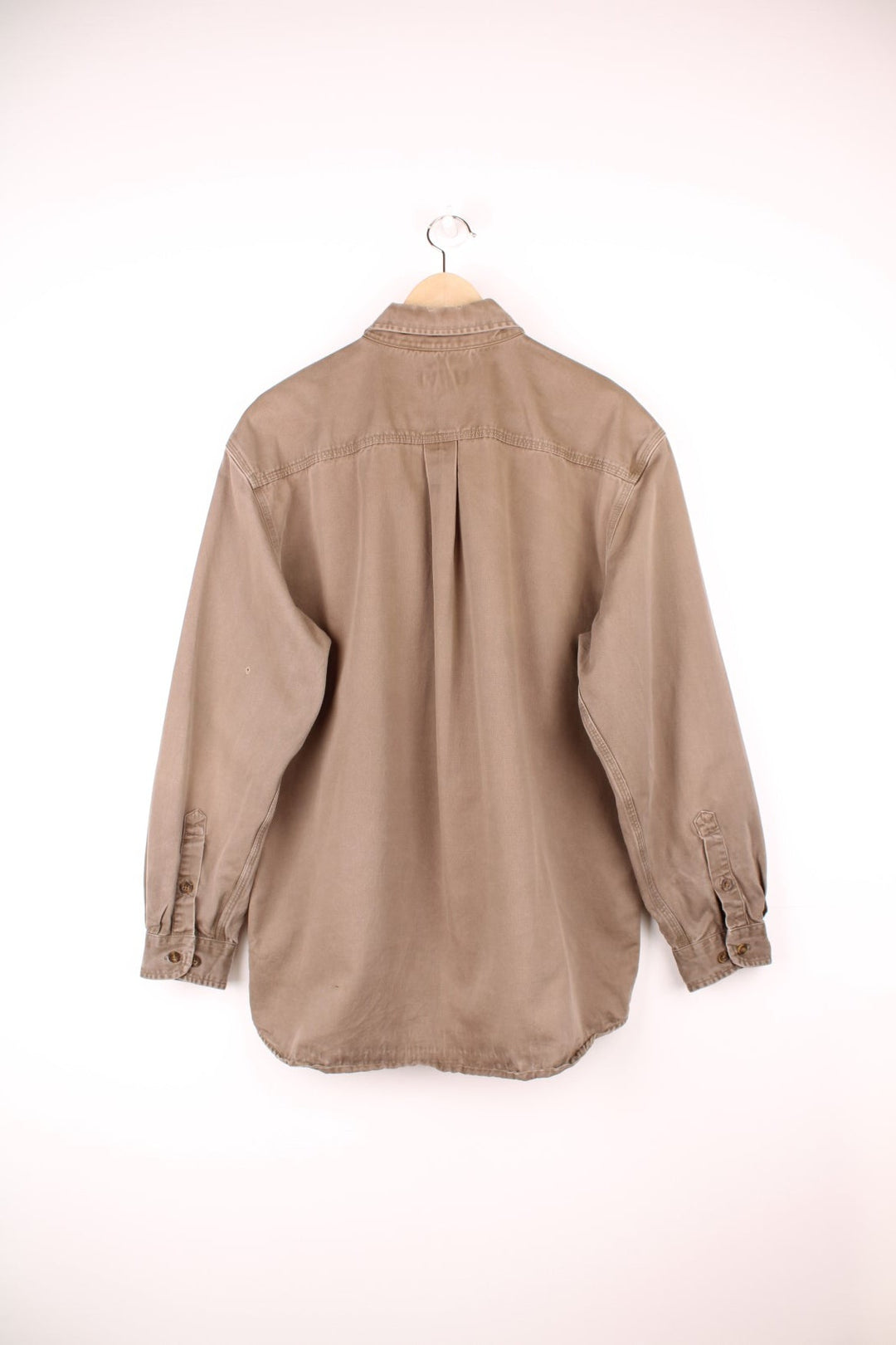 Carhartt brown canvas shirt. Features chest pockets and embroidered leather logo.